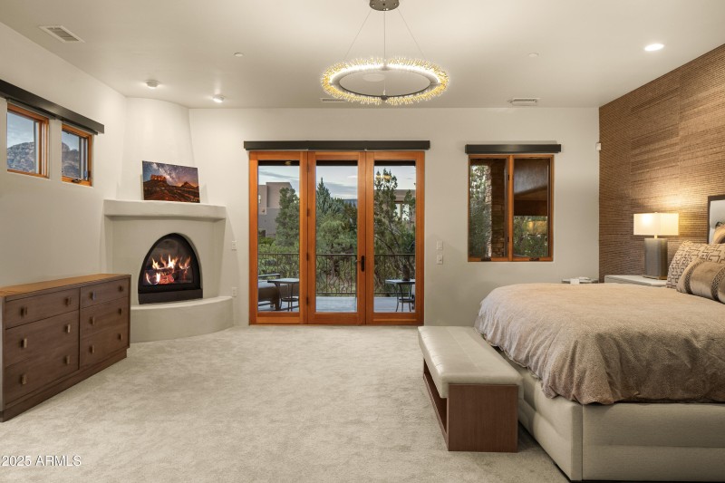 PRIMARY BEDROOM WITH COZY KIVA GAS FIREP