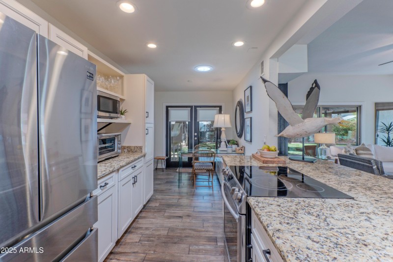 Open kitchen with stainless appliances