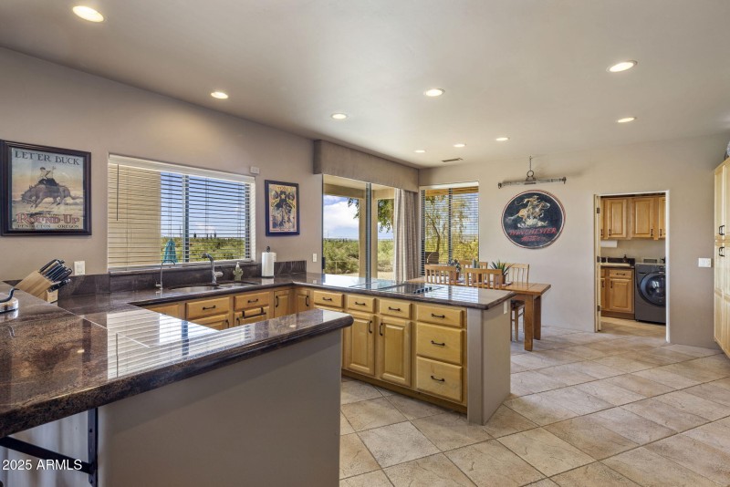 Eat-in kitchen towards laundry