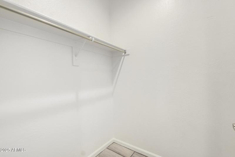 Walk-in closet in guest bedroom