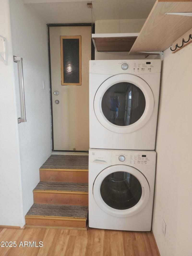 55. Stack Washer and dryer in AZ room.