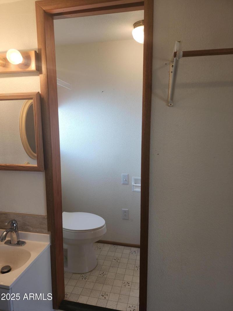 57. AZ toilet and walk-in shower.