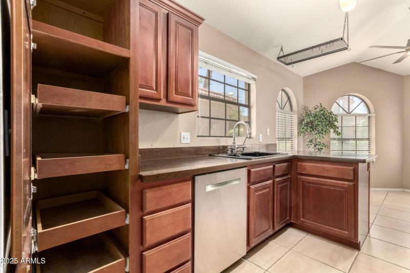 KITCHEN HAS CONVENIENT PULL-OUT DRAWERS