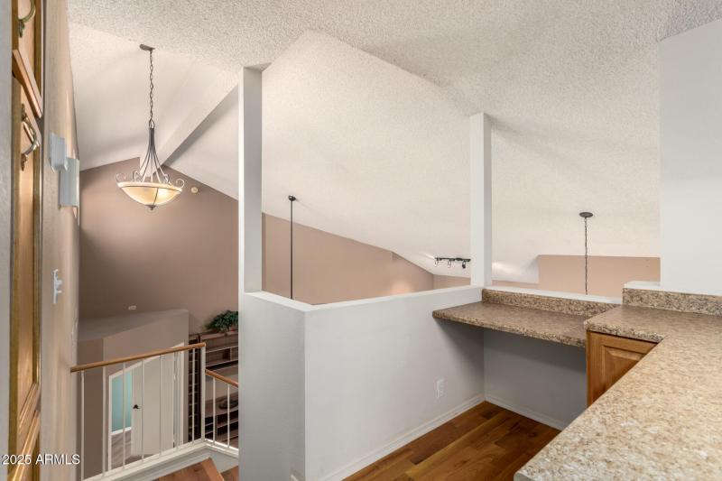 OFFICE LOFT OVERLOOKS LIVING ROOM