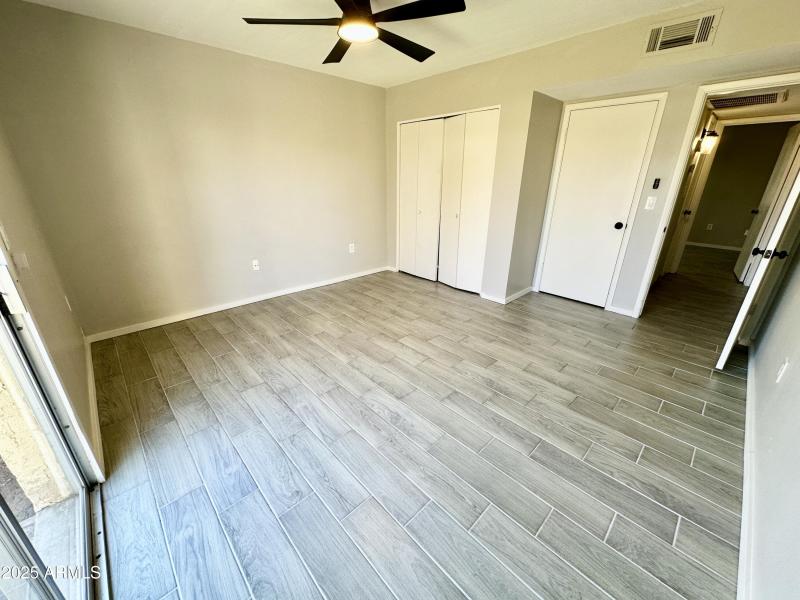 Another view of primary bedroom