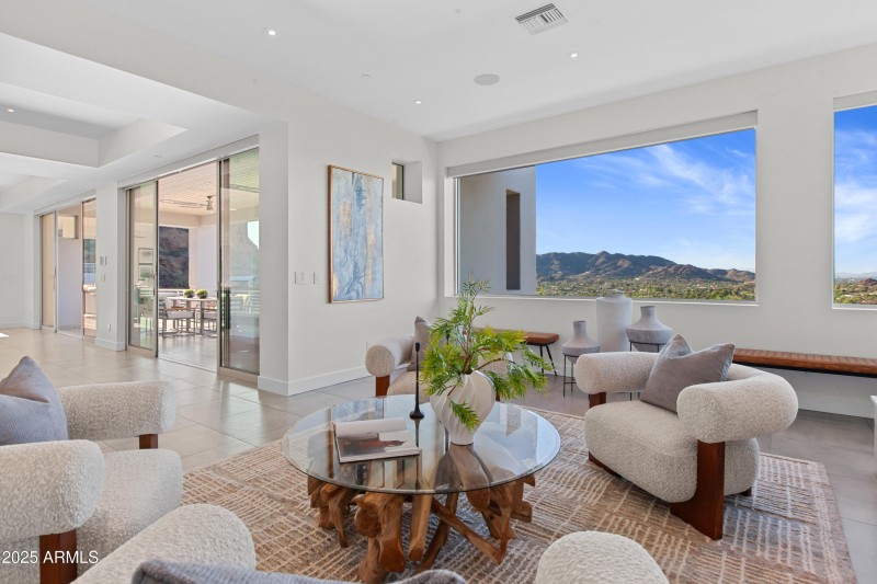 Living room open to dining and views