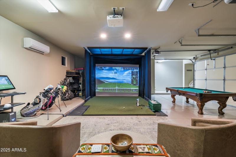 golf sim and game room in garage