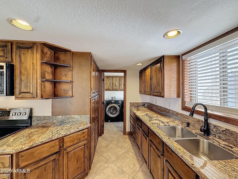 Kitchen with laudry beyond