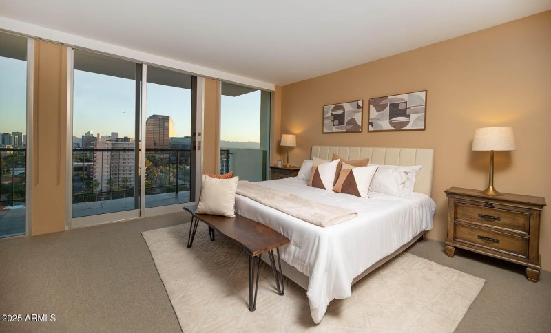 23 Primary Bedroom with Balcony and BMO