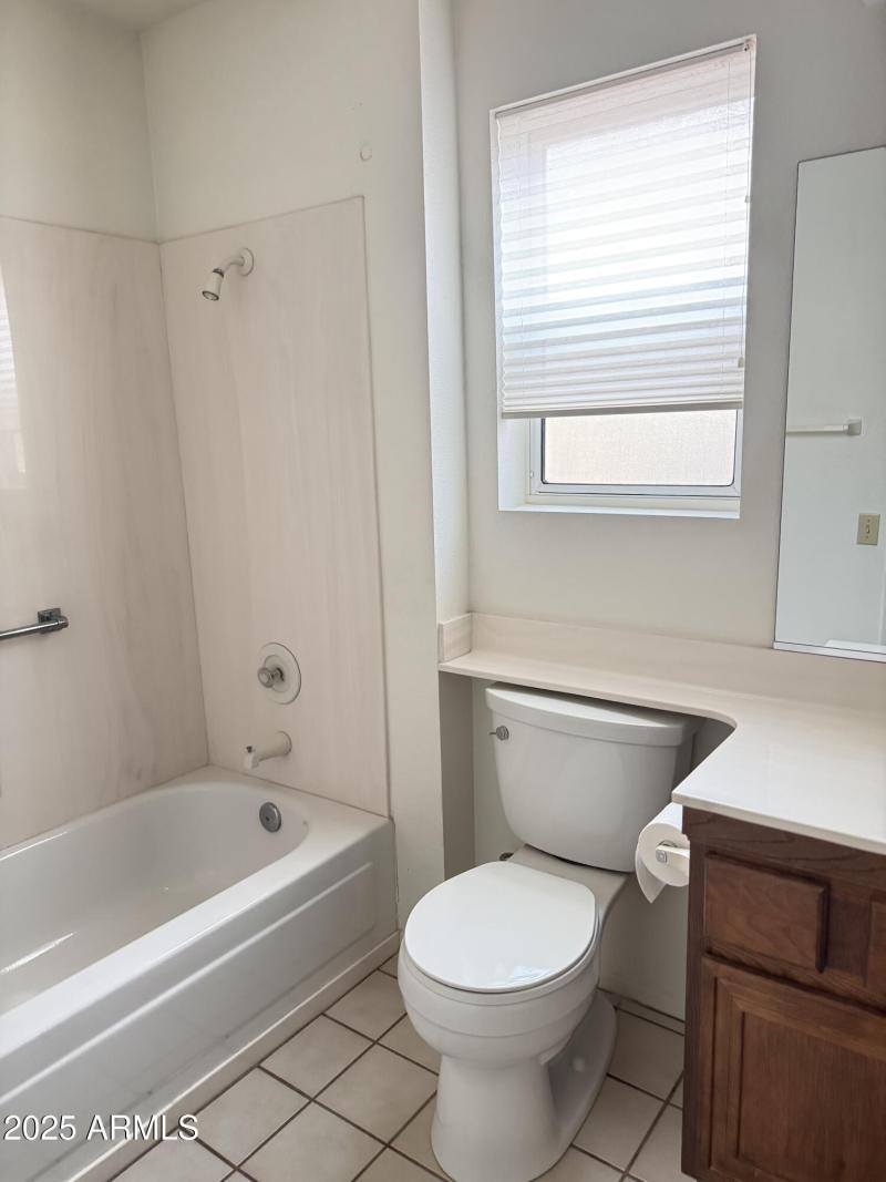 hall bathroom with tub and shower