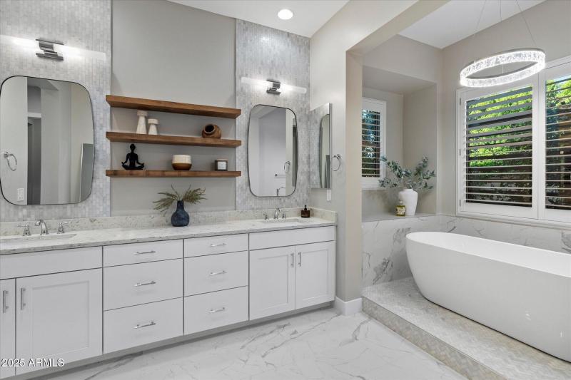 luxurious primary bath with soaking tub