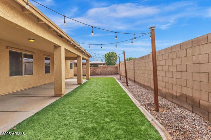 5704 S. 57TH DR SOLD MEDIA BACKYARD