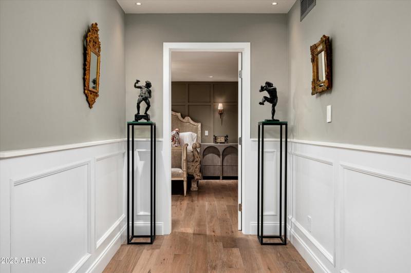 Wide Hallways Lead to Primary Suite