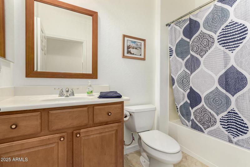 guest bath with tub shower combo