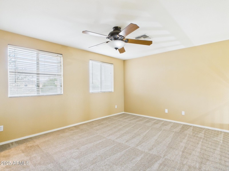 Secondary bedroom with walk in closet