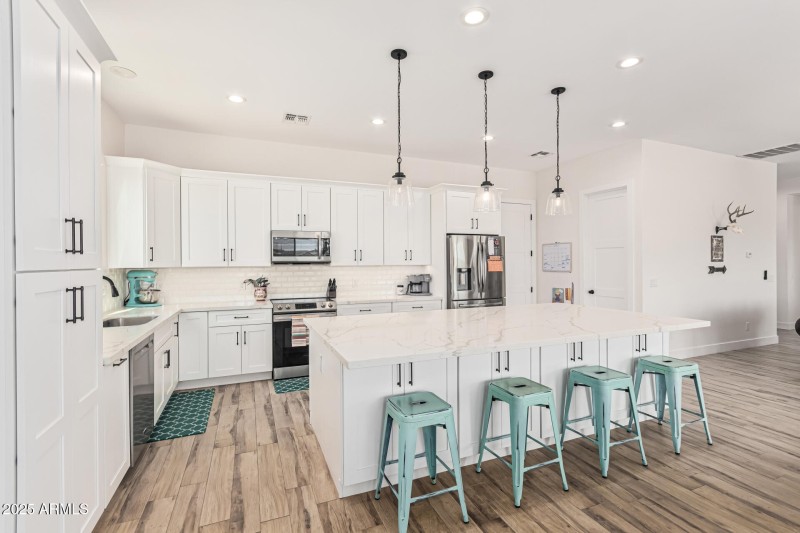 massive island and shaker cabinets