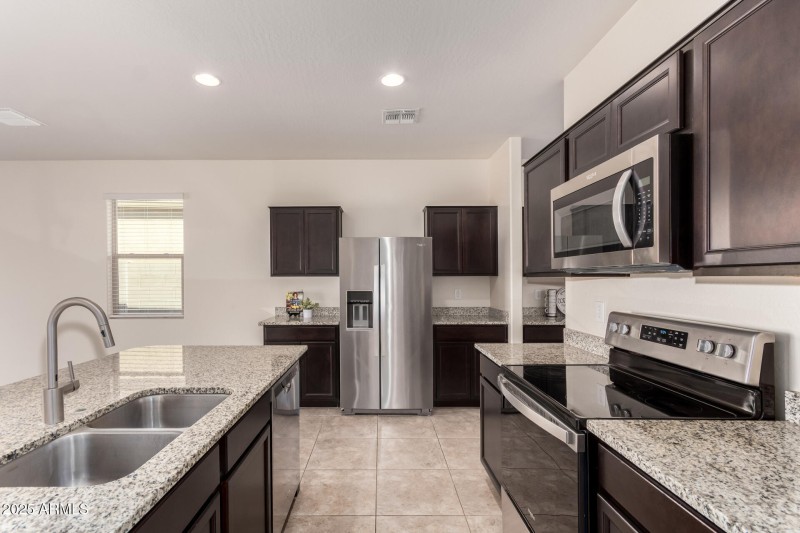 Spacious Kitchen With Espresso Cabinets