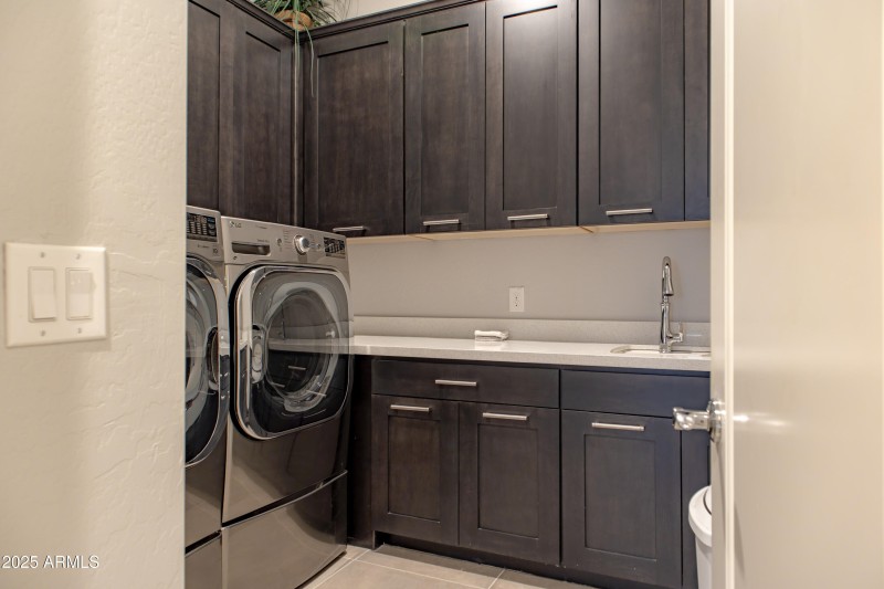 Large laundry with cabinets