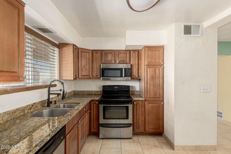 Kitchen overlooks great room & dining