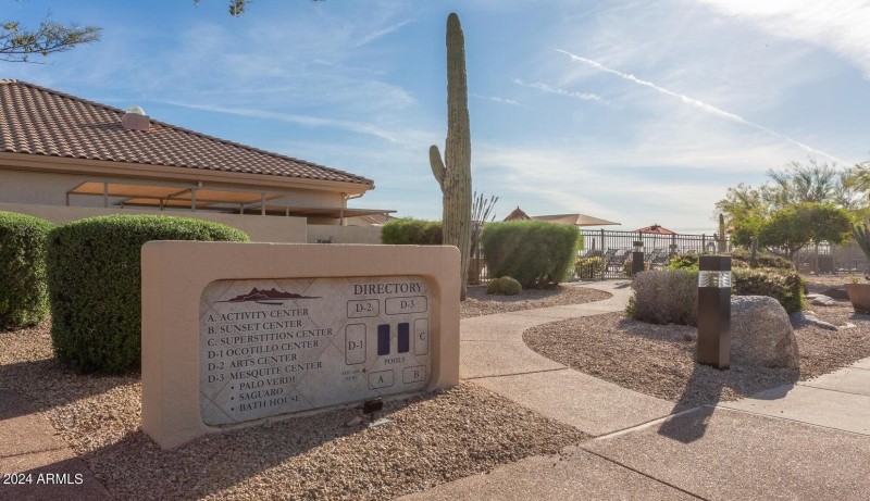 Walkway to pool by Sign