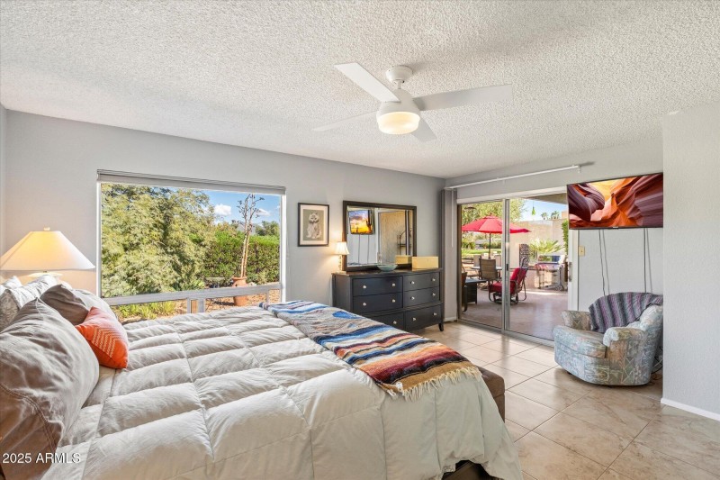 Primary bedroom with patio access
