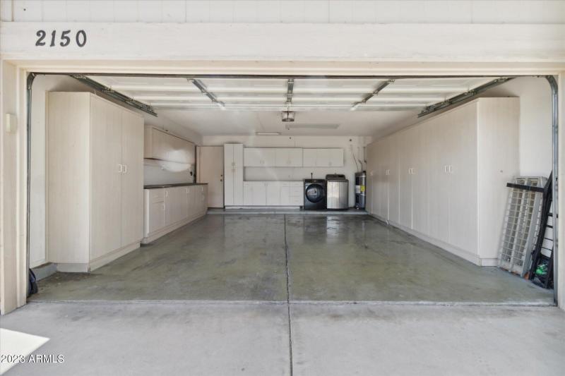 2 Car Garage w/ cabinets & Laundry