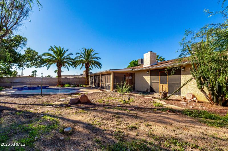 View of Large Back Yard and Back of Home