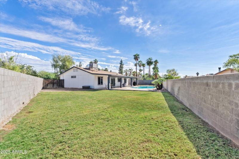 Oversized backyard with grass