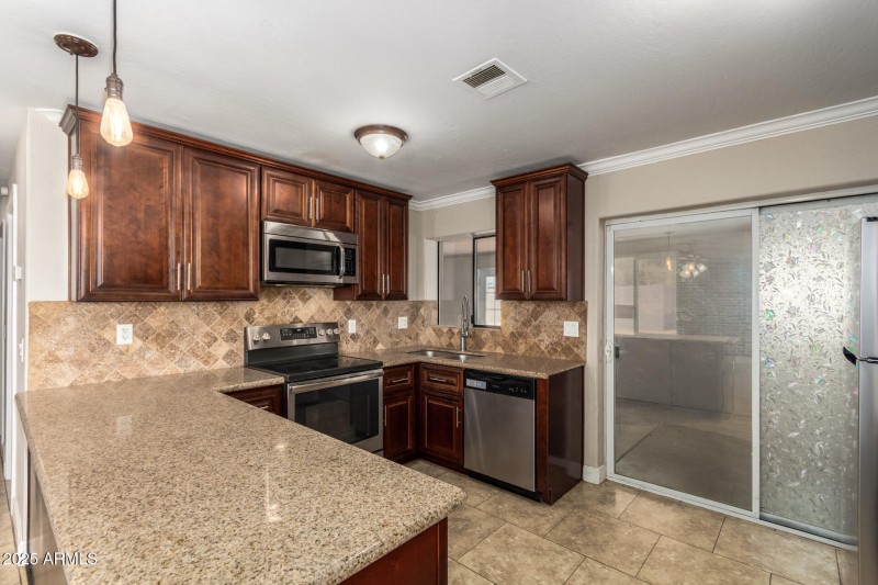 Dark cabinetry with granite counters