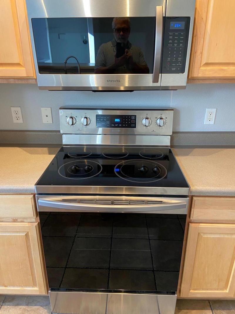 NEWER STAINLESS OVEN AND MICROWAVE!