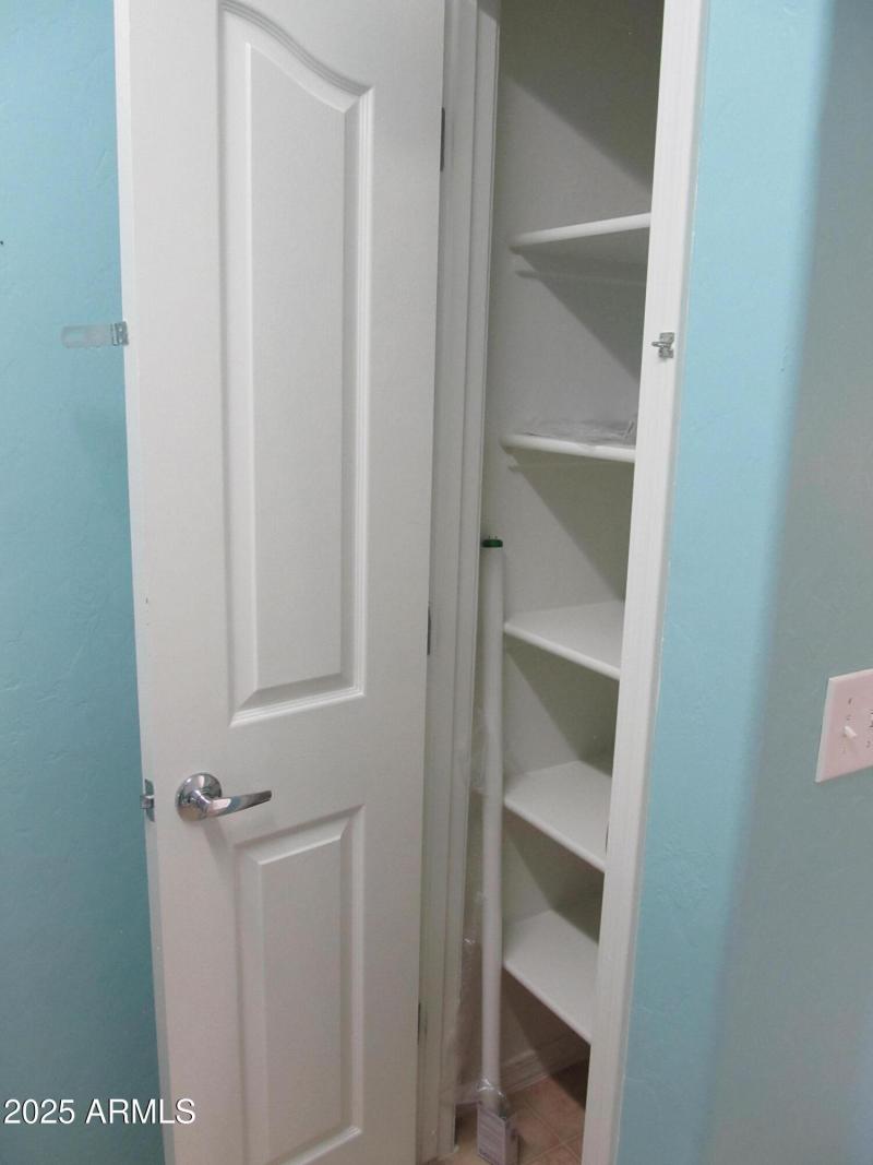 Linen closet in laundry room