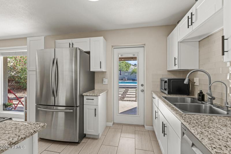 Kitchen - Spacious Backyard & Pool Views