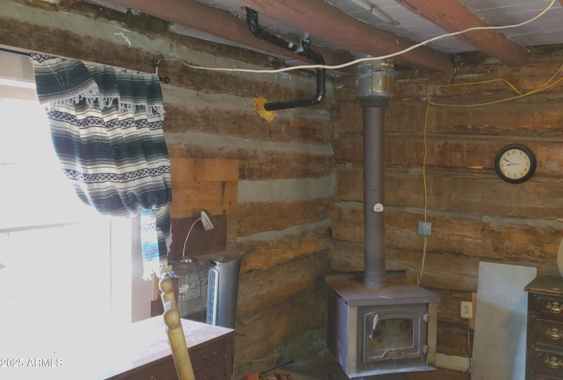 Log Hm Window N side & Wood Stove