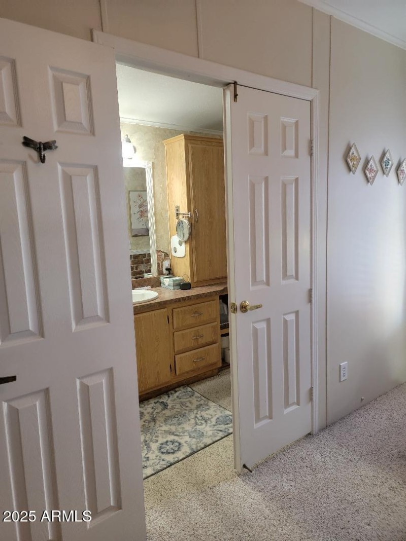 primary bedroom looking into bathroom