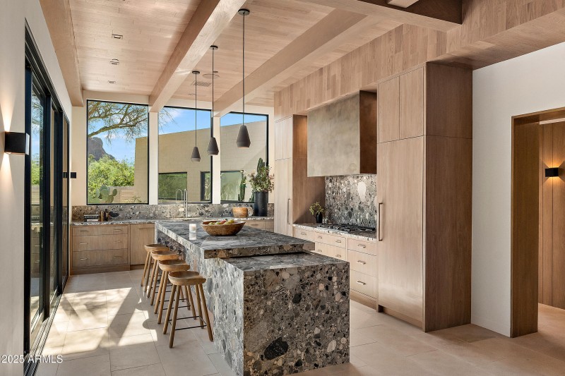 Chef's kitchen open to outdoor seating