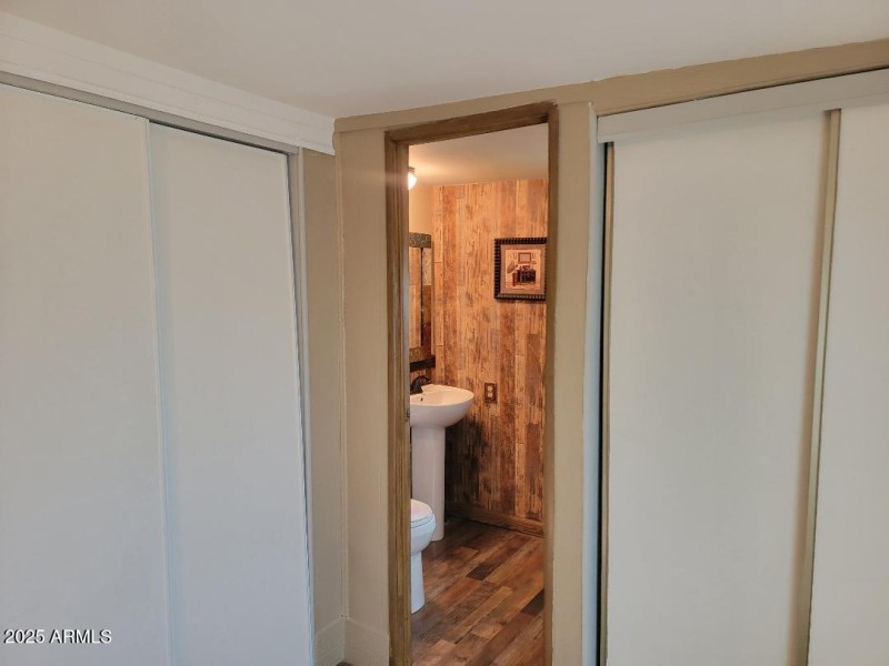 guest bedroom looking into half bath