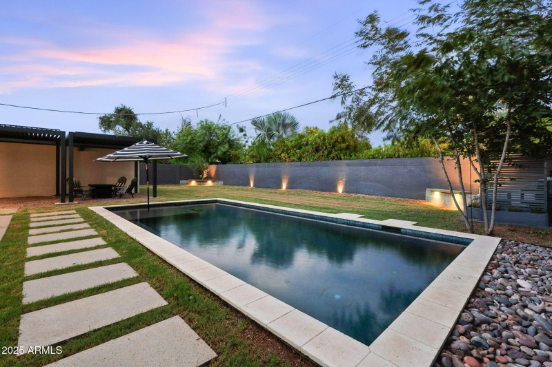 back yard with custom lighting