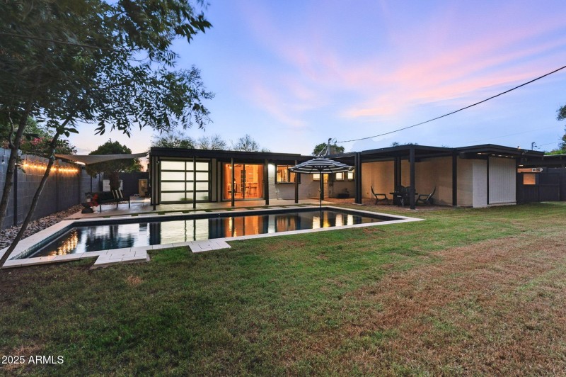 back yard with custom lighting