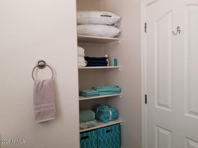 Linen area behind bathroom door