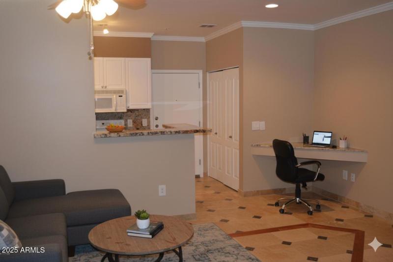 Built in desk and living room off kitche