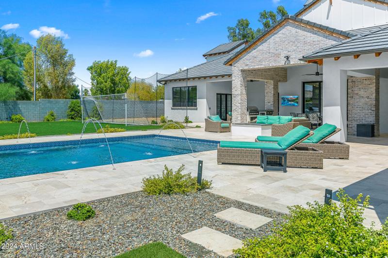 75pool loungers and backyard view
