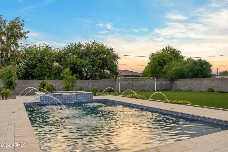 93poolscape and oversized yard at sunset