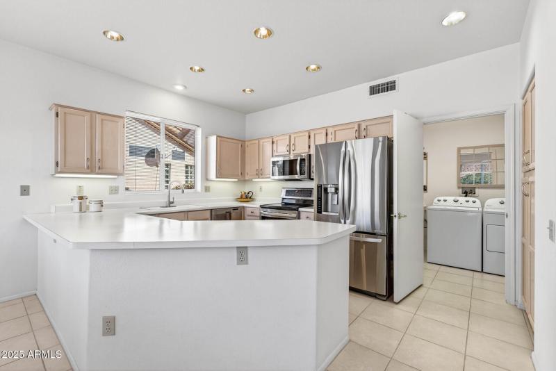 Kitchen towards Laundry and Bonus Rms