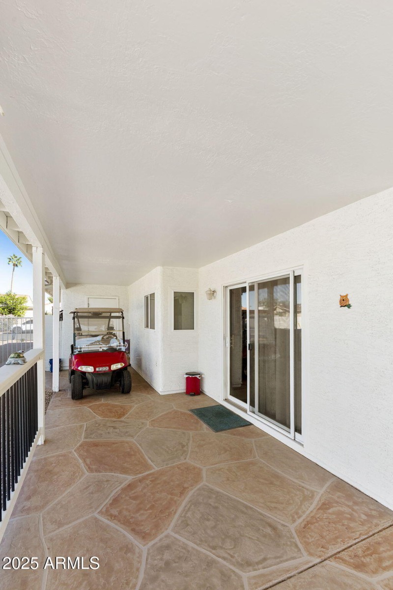 Covered patio with golf cart storage