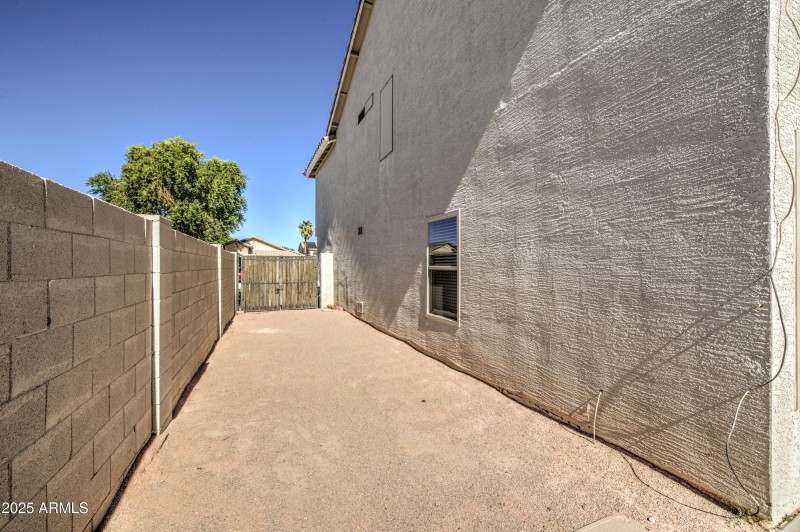 Side yard with x-wide gate