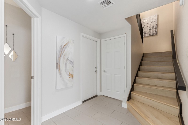 Garage Exit & Steps to Bedrooms