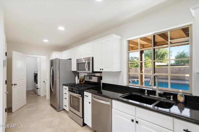 Kitchen overlooking backyard
