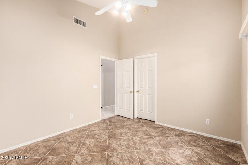 Secondary bedroom with walk in closet