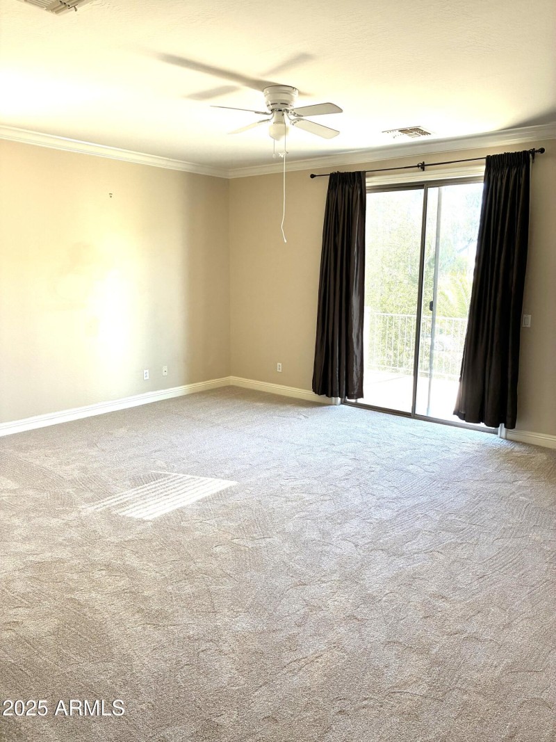 upstairs bedroom with balcony