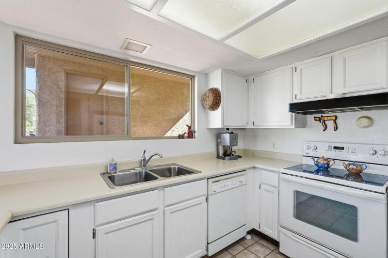 Kitchen overlooks side patio